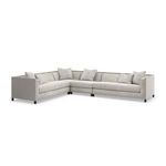L-shaped sectional sofa including multiple Tuxedo armless chairs in a bright room setting
