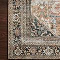 Edge of rug folded back exposing underside, showing texture and border stitching detail