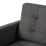 Close-up of backrest upper corner showing tufting and fabric weave detail
