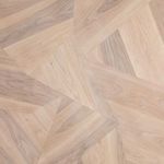 Close-up of Brooklyn Dining Table’s wood grain texture emphasizing natural color variation in veneer