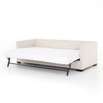 Full view of sofa bed with mattress completely unfolded into bed position