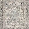 Rectangular Mika Grey / Blue Rug with abstract tribal medallion pattern and ornate border in muted tones