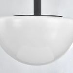 Close-up of smooth opal glass bottom surface and metal canopy top detail