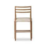Back view revealing the gently curved ladderback design and fabric seat of the stool