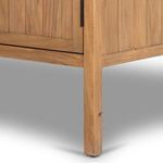 Close-up of Knightdale Brown Wooden Cabinet leg with slight wood distress marks