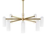 Chandelier viewed from below, displaying symmetrical arrangement of glass cylinders and brass arms