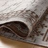 Rolled section of Easton rug showing woven polypropylene texture and flexible construction