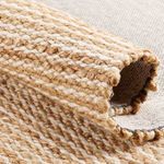 Rolled edge showing thickness and texture of beige and ivory wool and jute weave