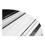 Detailed close-up of marble surface highlighting the variation in black and white striations and veins on the table top