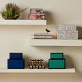 Casey Mother-of-Pearl Box styled on open shelf with other decorative boxed in neutral and colorful tones