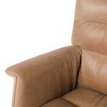 Detailed shot of right armrest and adjoining backrest leather upholstery joints