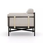 Hearst Outdoor Chair side view highlighting light sand upholstery and ivory strapping on frame