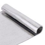 Close-up of curled scroll edge highlighting textured aluminium surface and metallic finish
