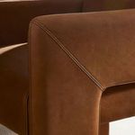 Front view with natural light showing flat seat cushion and thick legs of chair