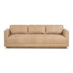Straight-on front view highlighting rectangular armrests and seat button tufting