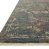 Corner edge of Giada Lagoon Multi Rug with visible border and short fringed ends on a white background.