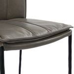 Front-facing view showcasing the vertical stitching on leather backrest and slim iron legs