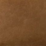 Macro texture detail showing the natural grain and finish of the butterscotch leather upholstery