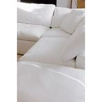 Detailed close-up of corner sectional cushions showing fabric texture and softness