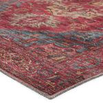 Close-up of rug corner showing detailed weave and color variation in red and blue fibers