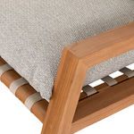 Close-up on teak frame corner and woven beige strap underneath the ash-toned seat cushion