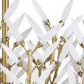 Close-up detail of white glass leaves and gold metal stems with visible leaf attachment points
