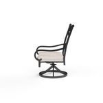 Side view showing the chair’s curved armrests, swivel base, and profile of light beige cushion