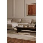 Rue Ottoman styled within sectional sofa setup in warm neutral living room with wood coffee table