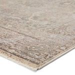 Close-up of textured rug edge with tightly woven fringe and soft fiber details