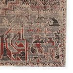 Close-up of corner showing tight weave and detailed multicolor pattern with red and black accents