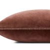 side view of cinnamon red velvet pillow showing edge piping and profile
