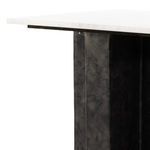 Room scene with Terrell End Table holding decorative vase next to curved beige lounge