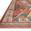 Close-up angled view showing Zion rug’s low-pile texture and detailed southern border pattern