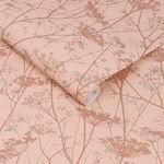 Close-up of two rolls of Wild Chervil wallpaper emphasizing fibrous texture and printed floral pattern