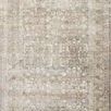 Traditional rectangular rug with muted grey and sage tones in an intricate vintage pattern