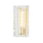 Baxford Wall Sconce isolated on white background with clear glass and aged brass details visible