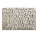 Macro image showing tight boucle fabric weave and soft texture on seat surface