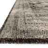 side angle close-up showing rug’s low pile texture and dark brown edging detail