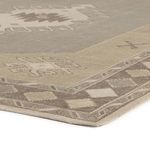 Close-up of Samsa rug corner highlighting geometric border and low pile texture