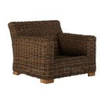 Side view of Montauk Raffia Lounge chair without cushions, showing woven texture and wooden legs