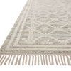 Side angle view highlighting fringe and edge craftsmanship of Rivers Lagoon ivory rug