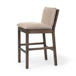 Wilmington Stool angled from the back showing almond wood frame and beige cushioned seat