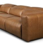 Detail close-up on wide armrest and seat cushions displaying soft leather upholstery and stitching