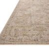 Close-up angled view showing Milena Ivory / Sand Rug's low pile texture and intricate border pattern