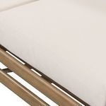 close-up of front left sofa armrest with natural wood finish