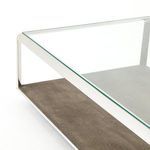 Detailed corner shot emphasizing the meeting point of glass, steel frame, and brown shagreen base
