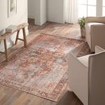 Matias Medallion rug styled in sunlit living room with neutral armchairs and wooden bench