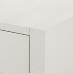 Close-up corner detail showing textured sand white finish and straight clean lines of dresser