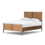 Woven rattan footboard panel with solid wood frame viewed from side angle