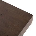 Top corner close-up showing wood grain detail and joinery of the desk's surface